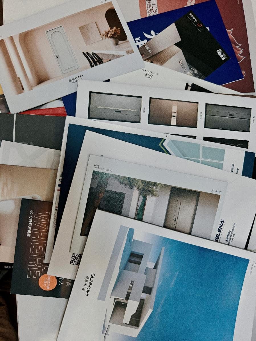 Catalog after catalog pointed the same way: clean lines, invisible frames, and 2026 "entrance door" minimalism.